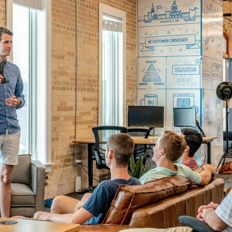 group of men in the workplace at a presentation
