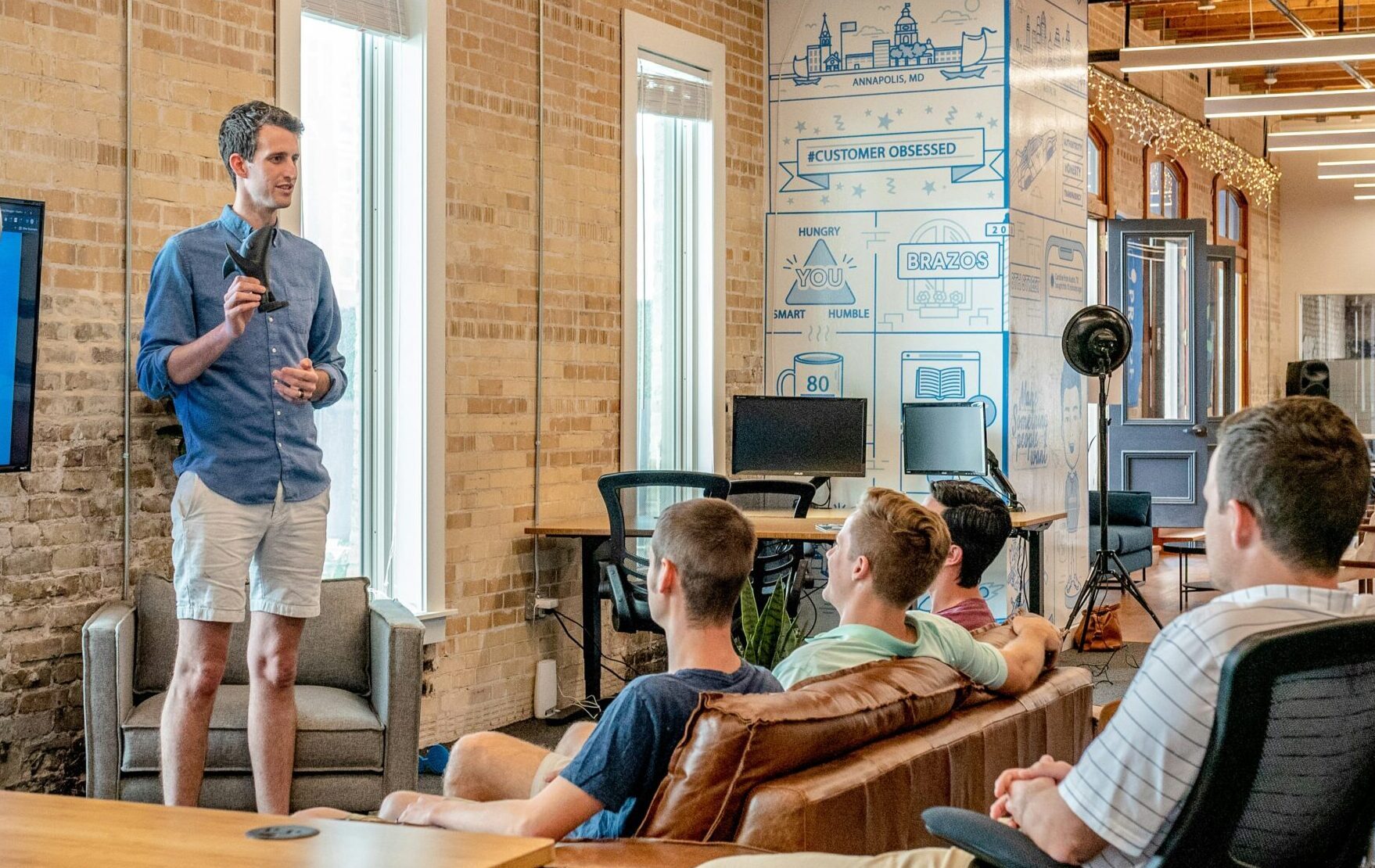 group of men in the workplace at a presentation