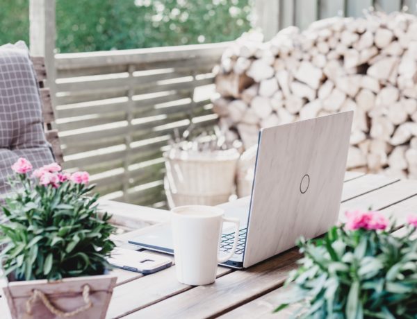 LinkedIn profile laptop on a desk with flowers