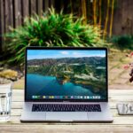 Macbook pro on garden bench outside